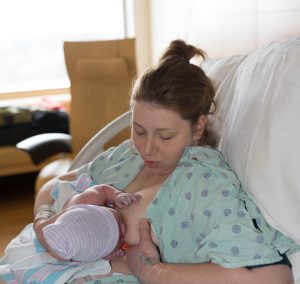 Intern Barb nursing her youngest Finn after birth.